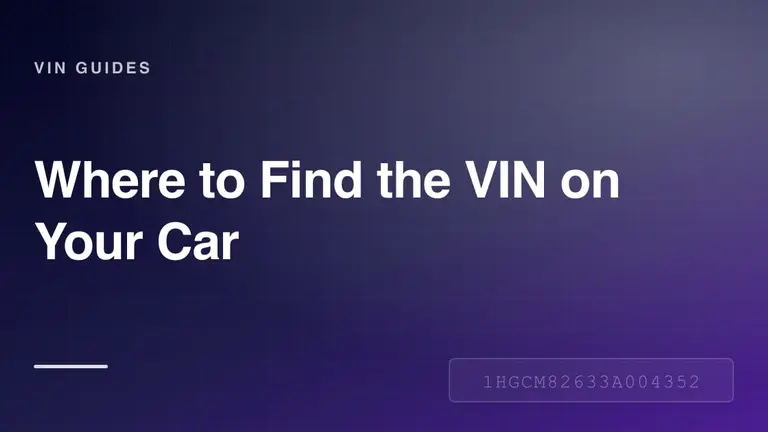 A car dashboard VIN plate visible through the base of the windshield